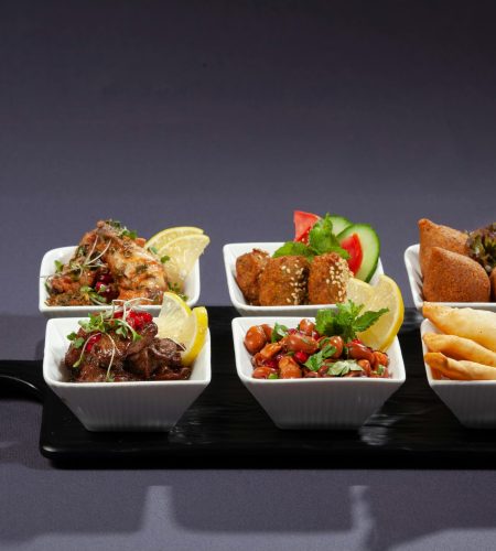 A vibrant selection of Middle Eastern appetizers served in elegant dishes, perfect for food photography enthusiasts.