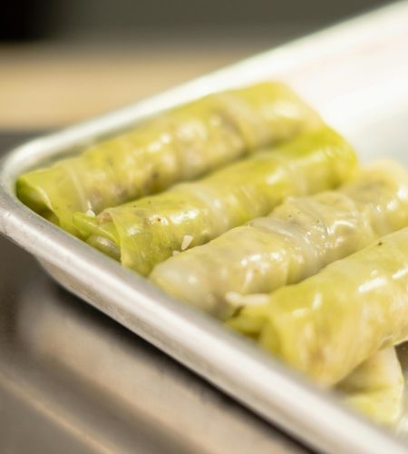 Delicious homemade stuffed cabbage rolls presented on a cooking tray in Santiago de Querétaro.
